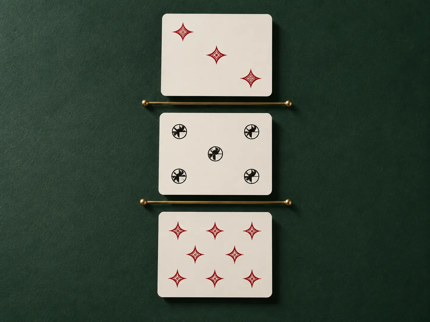 Three ivory cards aligned in an instructional sequence on green felt